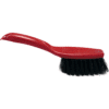 plastic hand brush- red handle, black bristles.